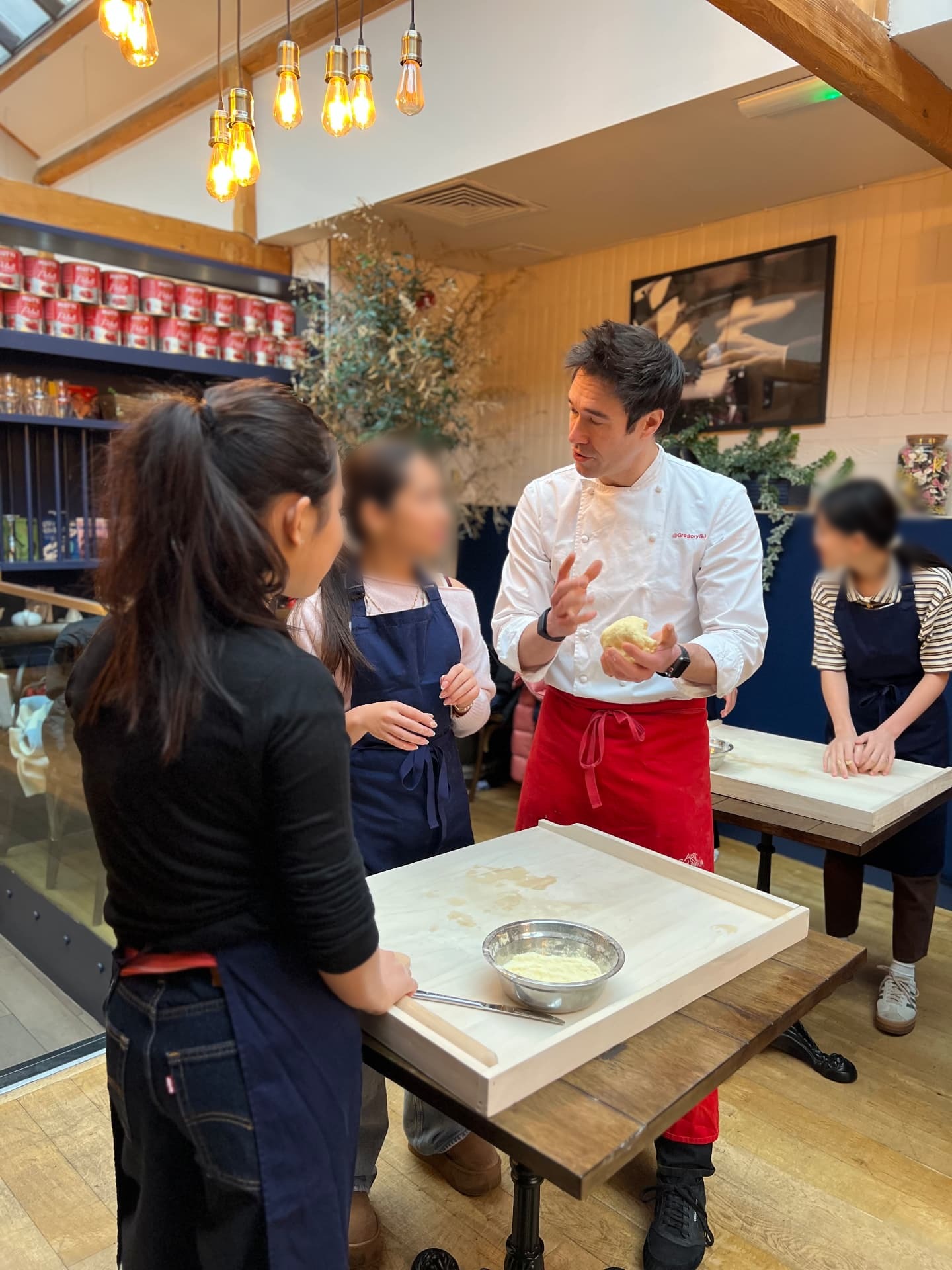 Gregory teaching a dough class to a group of engaged home cooks.